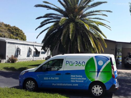 Pur360 service van parked outside a home with a palm tree next to it