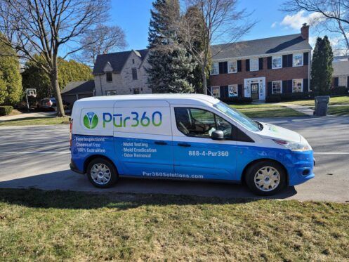 Pur360 service van parked on the street outside a home