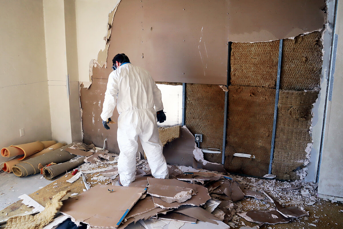 Pur360 team member taking drywall down